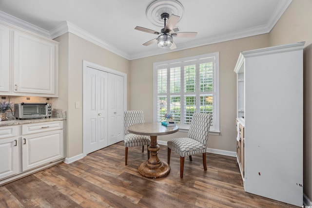 7005 Wellesley Ct, Murrells Inlet, SC 29576 - dining space with ceiling fan, dark wood-type flooring, and crown molding