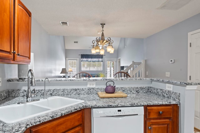 1102 Stanton Pl Unit 1102, Myrtle Beach, SC 29579 - kitchen featuring dishwasher, a sink, a chandelier, brown cabinetry, and pendant lighting