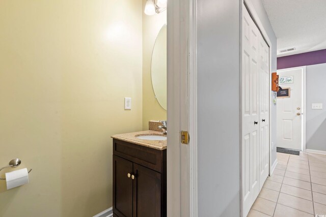 1102 Stanton Pl Unit 1102, Myrtle Beach, SC 29579 - bathroom with vanity, tile patterned flooring, and baseboards