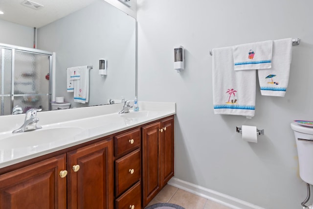 1102 Stanton Pl Unit 1102, Myrtle Beach, SC 29579 - full bathroom with toilet, tile patterned flooring, a stall shower, double vanity, and baseboards