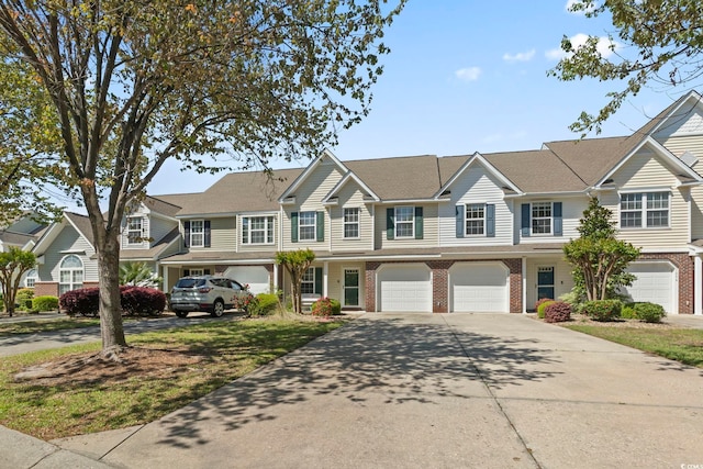 1102 Stanton Pl Unit 1102, Myrtle Beach, SC 29579 - view of property with driveway, brick siding, and an attached garage