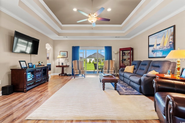 1025 Limpkin Dr, Conway, SC 29526 - living area featuring a raised ceiling, light wood-style floors, a ceiling fan, crown molding, and recessed lighting