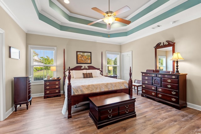 1025 Limpkin Dr, Conway, SC 29526 - bedroom featuring hardwood / wood-style floors, ornamental molding, a raised ceiling, and a ceiling fan
