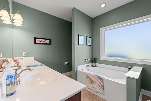 1025 Limpkin Dr, Conway, SC 29526 - full bathroom featuring double vanity, a bath, a chandelier, and tile patterned floors