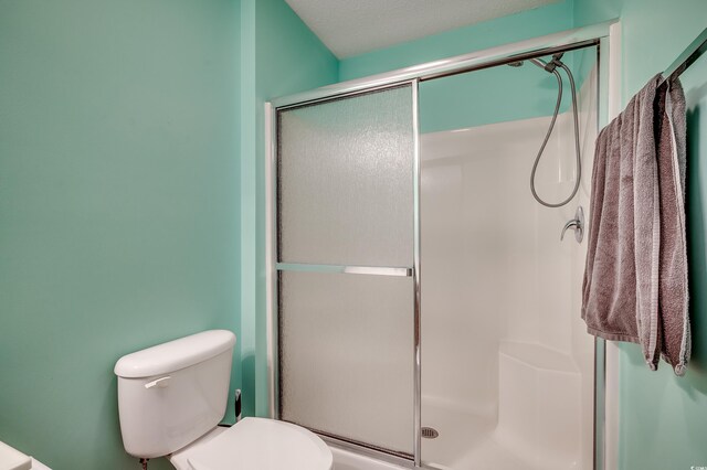 251 Egret Run Ln Unit 1122, Pawleys Island, SC 29585 - bathroom featuring a stall shower and toilet