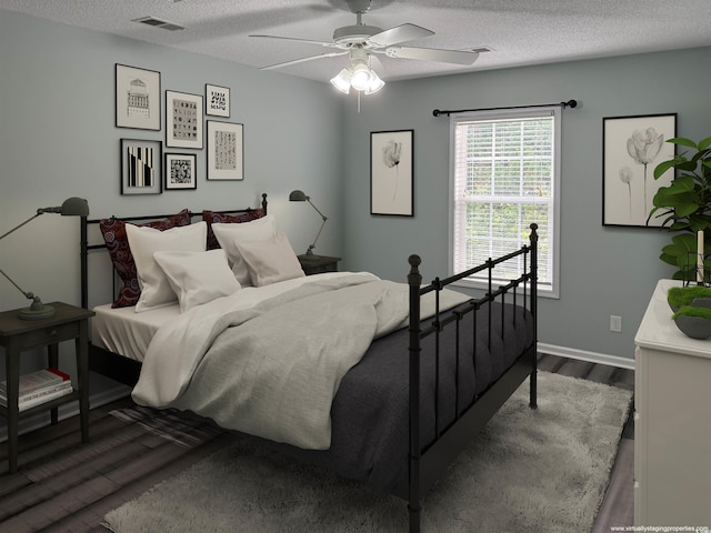 251 Egret Run Ln Unit 1122, Pawleys Island, SC 29585 - bedroom featuring wood finished floors, a textured ceiling, baseboards, and a ceiling fan