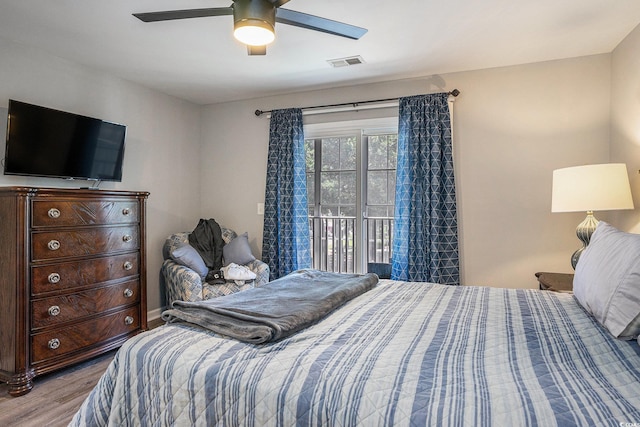4853 Meadowsweet Dr Unit 1805, Myrtle Beach, SC 29579 - bedroom with wood finished floors, access to exterior, and a ceiling fan