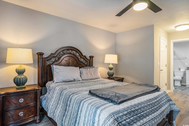 4853 Meadowsweet Dr Unit 1805, Myrtle Beach, SC 29579 - bedroom with wood finished floors, ensuite bath, baseboards, and a ceiling fan