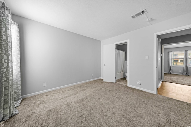 755 Burcale Rd Unit E-3, Myrtle Beach, SC 29579 - unfurnished bedroom featuring carpet flooring, baseboards, and ensuite bath