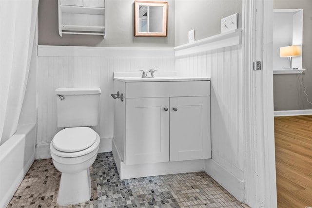 755 Burcale Rd Unit E-3, Myrtle Beach, SC 29579 - bathroom featuring a wainscoted wall, toilet, vanity, and shower / bathtub combination with curtain