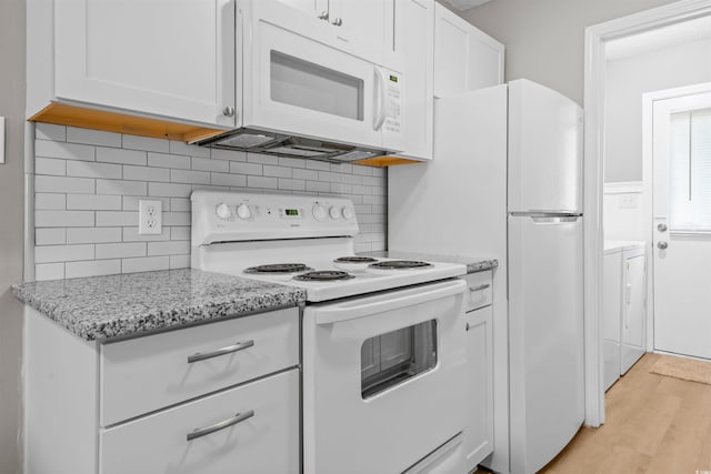 755 Burcale Rd Unit E-3, Myrtle Beach, SC 29579 - kitchen featuring white appliances, light wood finished floors, white cabinets, tasteful backsplash, and light stone countertops