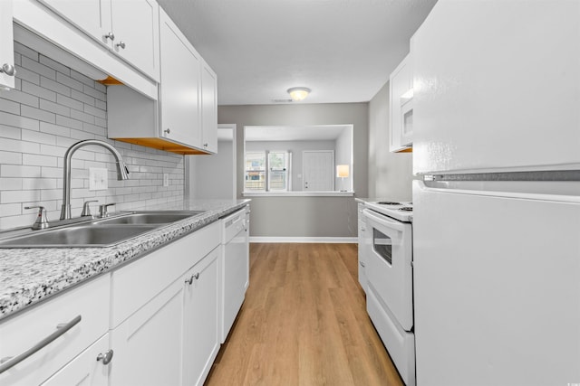 755 Burcale Rd Unit E-3, Myrtle Beach, SC 29579 - kitchen featuring white appliances, a sink, backsplash, light wood finished floors, and white cabinetry