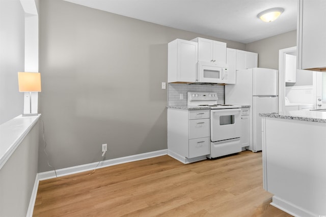 755 Burcale Rd Unit E-3, Myrtle Beach, SC 29579 - kitchen with white appliances, light wood-style floors, white cabinetry, tasteful backsplash, and light stone countertops
