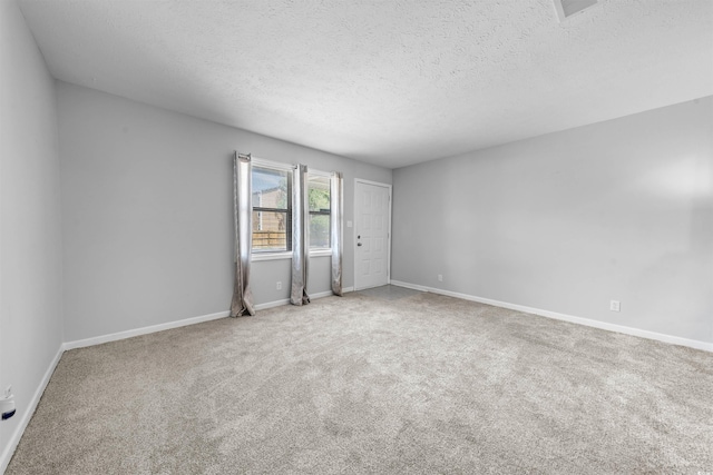 755 Burcale Rd Unit E-3, Myrtle Beach, SC 29579 - carpeted spare room featuring a textured ceiling and baseboards