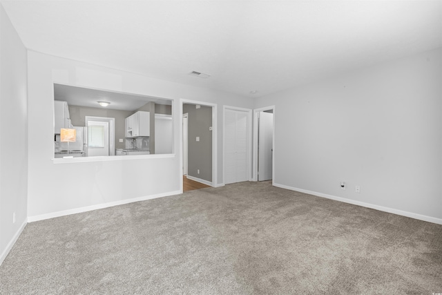 755 Burcale Rd Unit E-3, Myrtle Beach, SC 29579 - unfurnished living room featuring carpet flooring and baseboards