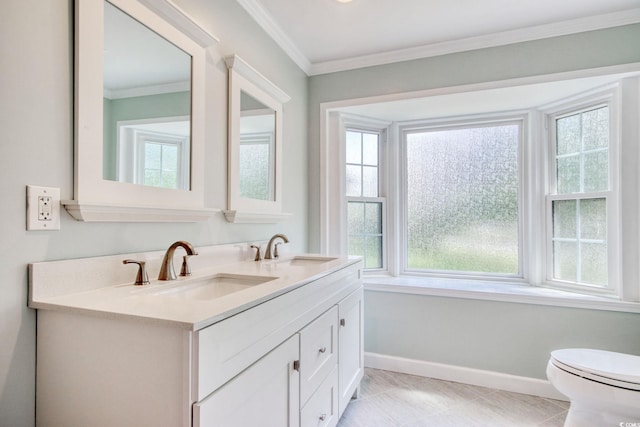 900 47th Ave N, Myrtle Beach, SC 29577 - bathroom featuring baseboards, double vanity, plenty of natural light, and crown molding