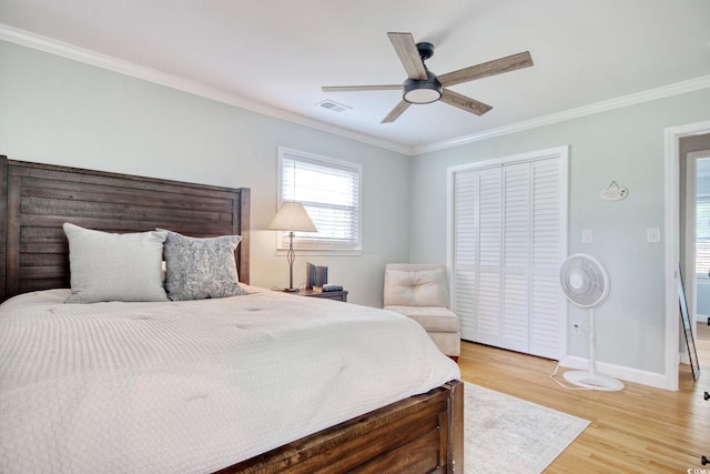 900 47th Ave N, Myrtle Beach, SC 29577 - bedroom featuring ornamental molding, baseboards, light wood-type flooring, a closet, and ceiling fan