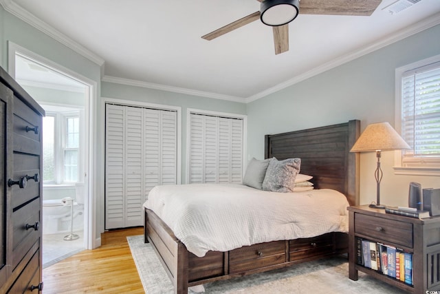 900 47th Ave N, Myrtle Beach, SC 29577 - bedroom featuring ornamental molding, light wood-style flooring, two closets, a ceiling fan, and ensuite bath