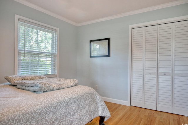 900 47th Ave N, Myrtle Beach, SC 29577 - bedroom featuring crown molding, wood finished floors, a closet, and baseboards