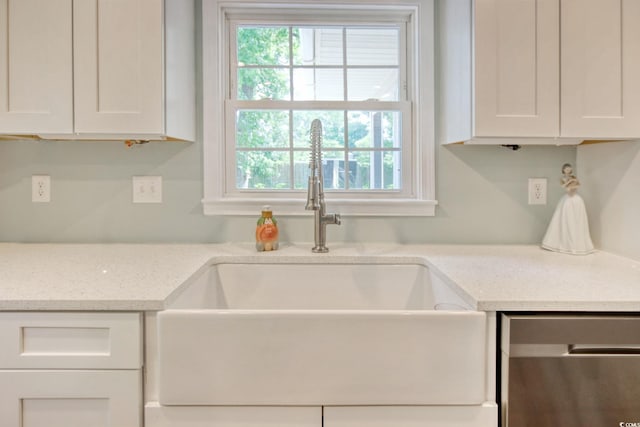 900 47th Ave N, Myrtle Beach, SC 29577 - kitchen featuring a sink, dishwasher, healthy amount of natural light, and white cabinets