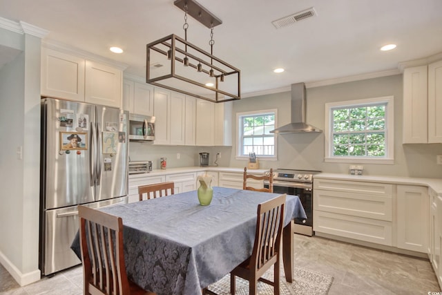 900 47th Ave N, Myrtle Beach, SC 29577 - kitchen featuring stainless steel appliances, wall chimney range hood, crown molding, light countertops, and recessed lighting