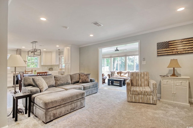900 47th Ave N, Myrtle Beach, SC 29577 - living area with light colored carpet, crown molding, recessed lighting, ceiling fan, and baseboards