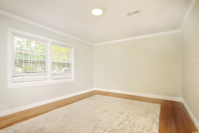 900 47th Ave N, Myrtle Beach, SC 29577 - spare room featuring ornamental molding, wood finished floors, and baseboards