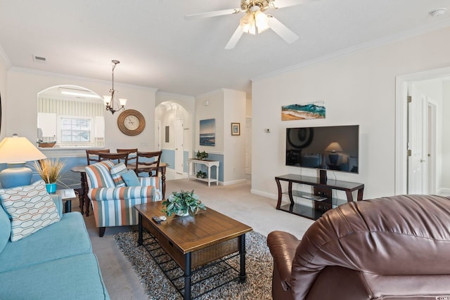 5750 Oyster Catcher Dr Unit 822, North Myrtle Beach, SC 29582 - living area featuring arched walkways, ornamental molding, light colored carpet, ceiling fan, and a chandelier