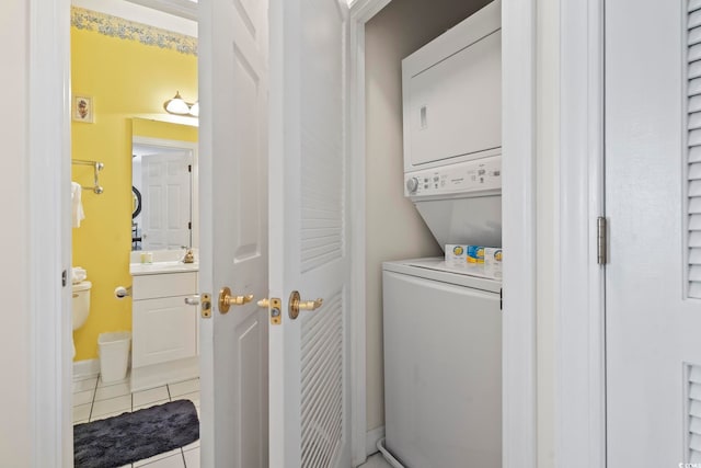 5750 Oyster Catcher Dr Unit 822, North Myrtle Beach, SC 29582 - laundry room with stacked washer and clothes dryer and light tile patterned flooring