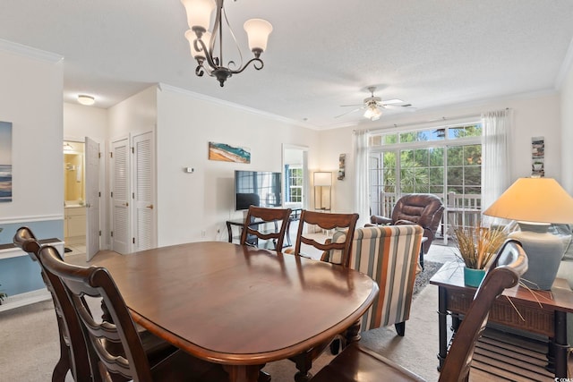 5750 Oyster Catcher Dr Unit 822, North Myrtle Beach, SC 29582 - carpeted dining space featuring a chandelier, a ceiling fan, and crown molding