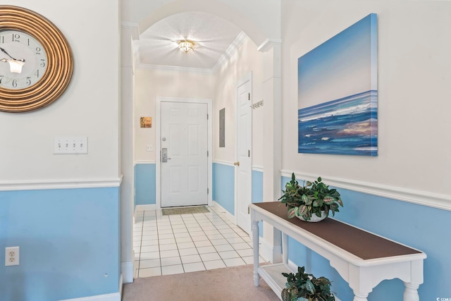 5750 Oyster Catcher Dr Unit 822, North Myrtle Beach, SC 29582 - foyer with tile patterned flooring, arched walkways, and ornamental molding