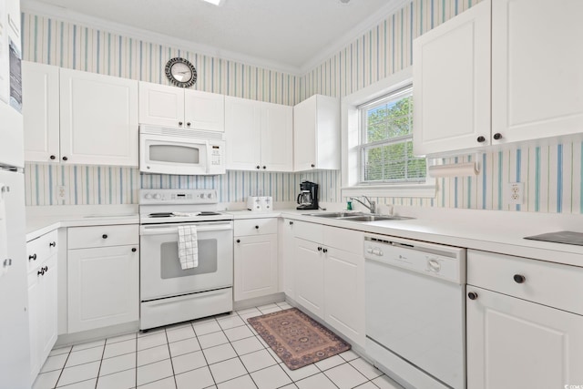 5750 Oyster Catcher Dr Unit 822, North Myrtle Beach, SC 29582 - kitchen with white appliances, wallpapered walls, light countertops, ornamental molding, and white cabinetry