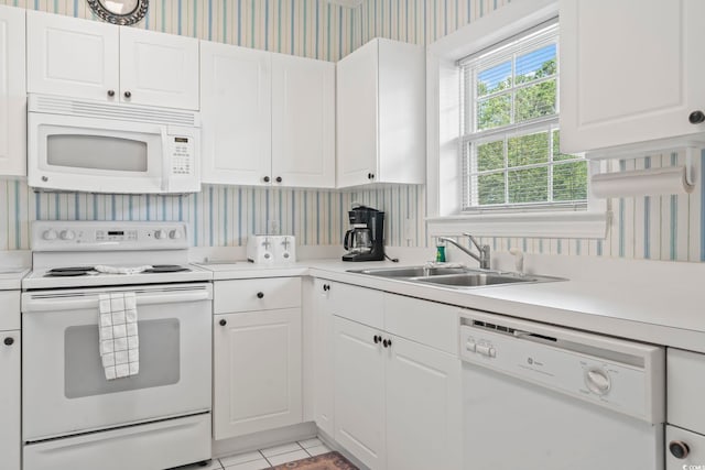 5750 Oyster Catcher Dr Unit 822, North Myrtle Beach, SC 29582 - kitchen featuring white appliances, wallpapered walls, light countertops, white cabinets, and light tile patterned flooring