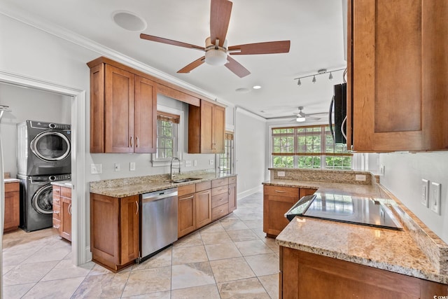 528 Chamberlin Rd, Myrtle Beach, SC 29588 - kitchen with appliances with stainless steel finishes, stacked washer and clothes dryer, a sink, ornamental molding, and brown cabinetry