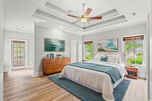 528 Chamberlin Rd, Myrtle Beach, SC 29588 - bedroom with a raised ceiling, crown molding, light wood-style flooring, baseboards, and a ceiling fan