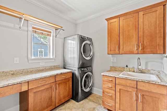 528 Chamberlin Rd, Myrtle Beach, SC 29588 - washroom with estacked washer and dryer, ornamental molding, cabinet space, baseboards, and light tile patterned flooring