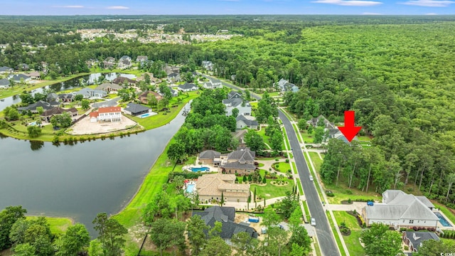528 Chamberlin Rd, Myrtle Beach, SC 29588 - aerial overview of property's location with a large body of water, nearby suburban area, and a heavily wooded area
