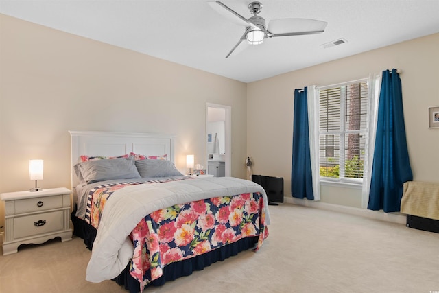 4826 Keel Ct, Myrtle Beach, SC 29579 - bedroom with light colored carpet, a ceiling fan, and connected bathroom