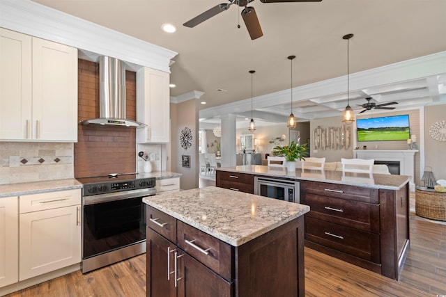4826 Keel Ct, Myrtle Beach, SC 29579 - kitchen featuring appliances with stainless steel finishes, a ceiling fan, wall chimney exhaust hood, a kitchen island, and open floor plan