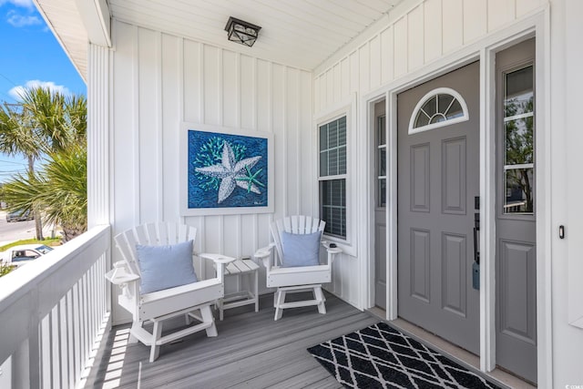 2405 Duffy St, North Myrtle Beach, SC 29582 - view of exterior entry with board and batten siding and a porch