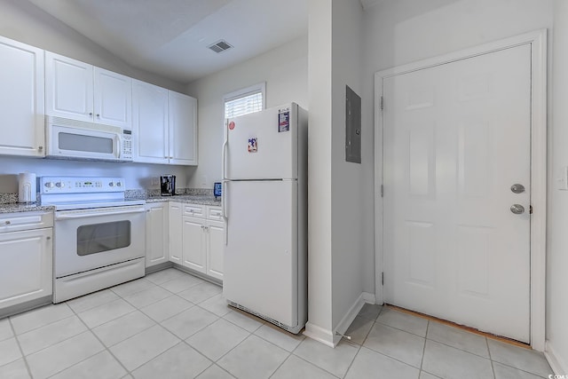 601 N Hillside Dr Unit 4434, North Myrtle Beach, SC 29582 - kitchen with white appliances, electric panel, white cabinets, light tile patterned floors, and light stone counters