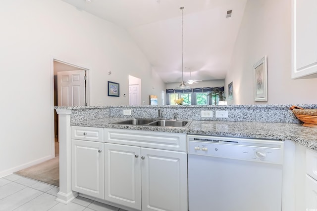 601 N Hillside Dr Unit 4434, North Myrtle Beach, SC 29582 - kitchen with white dishwasher, lofted ceiling, white cabinetry, light stone counters, and light tile patterned floors