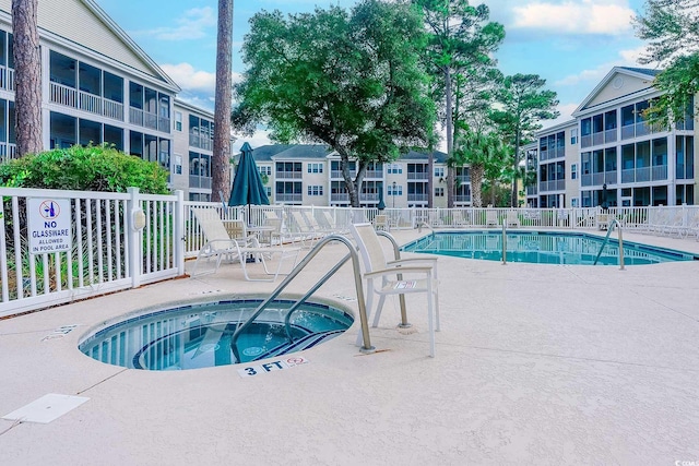 601 N Hillside Dr Unit 4434, North Myrtle Beach, SC 29582 - community pool featuring a hot tub and a patio area