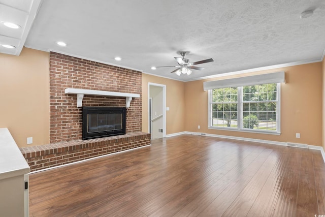 1043 S Main St, Aynor, SC 29511 - unfurnished living room featuring ceiling fan, wood finished floors, recessed lighting, crown molding, and baseboards