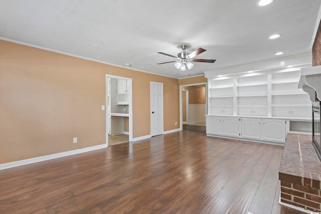 1043 S Main St, Aynor, SC 29511 - unfurnished living room with ceiling fan, dark wood-type flooring, crown molding, recessed lighting, and baseboards