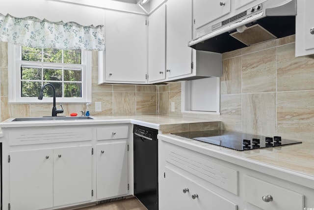 1043 S Main St, Aynor, SC 29511 - kitchen featuring under cabinet range hood, black appliances, a sink, tasteful backsplash, and light countertops