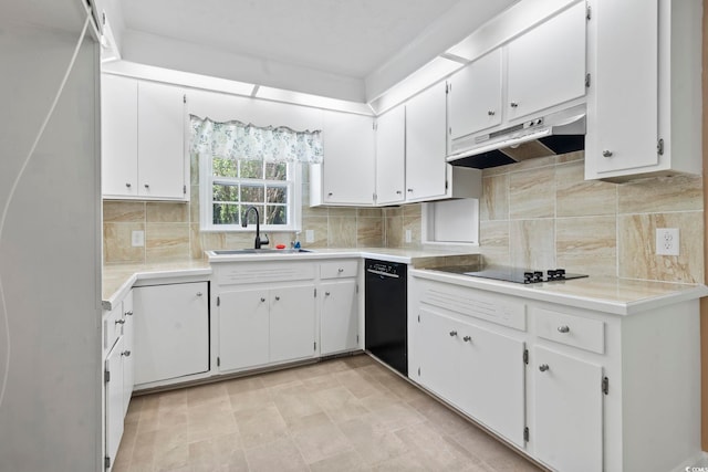 1043 S Main St, Aynor, SC 29511 - kitchen with under cabinet range hood, black appliances, a sink, and white cabinets