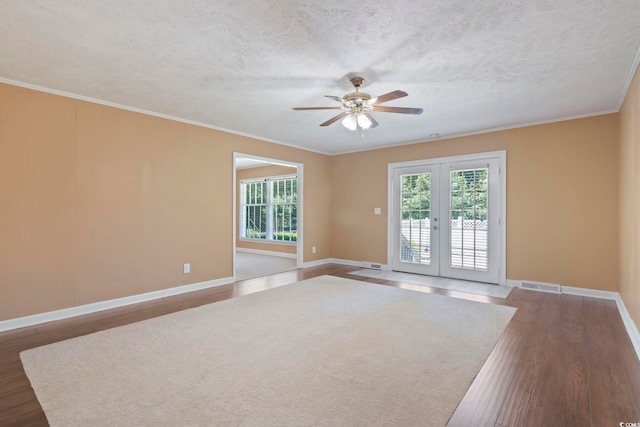 1043 S Main St, Aynor, SC 29511 - unfurnished room with wood finished floors, ceiling fan, baseboards, ornamental molding, and a textured ceiling
