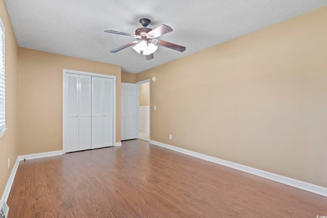 1043 S Main St, Aynor, SC 29511 - unfurnished bedroom featuring wood finished floors, baseboards, and a closet