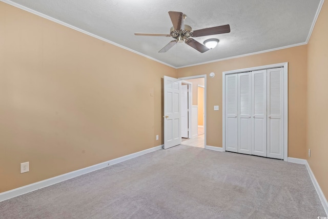 1043 S Main St, Aynor, SC 29511 - unfurnished bedroom with carpet, a closet, a textured ceiling, crown molding, and baseboards
